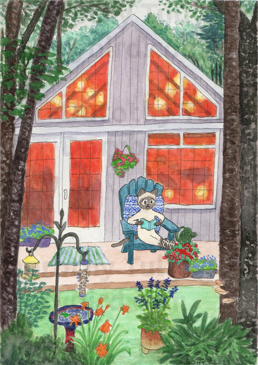 Watercolor illustration print: A Siamese cat is reading in an Adirondack chair outside a tiny cottage in the woods, surrounded by a colorful garden, with a cozy orange glow inside. By artist Dorothy Tully