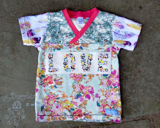 LOVE floral knit cotton kids top with birds, feathers on short sleeves, pink trim, pastel colors. Made in USA by Dorybird Handmade Baby and Kid Clothes